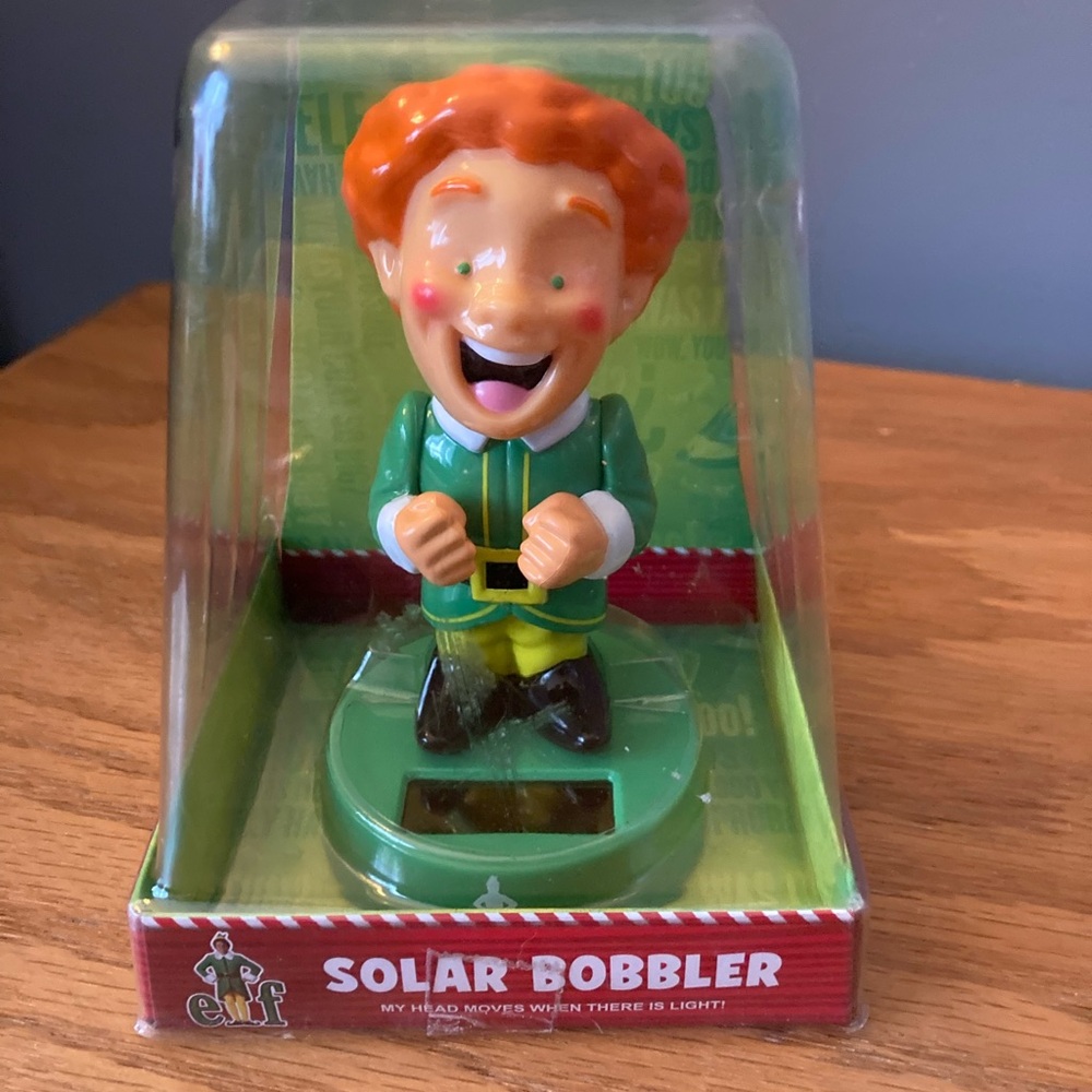 Buddy the Elf Will Ferrell  Solar Bobbler Toy - Green and Orange By Ruz